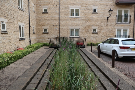 Fig 3.9: Examples of hard landscaped channels integrated into a high density town centre development. Riverside Court, Stamford